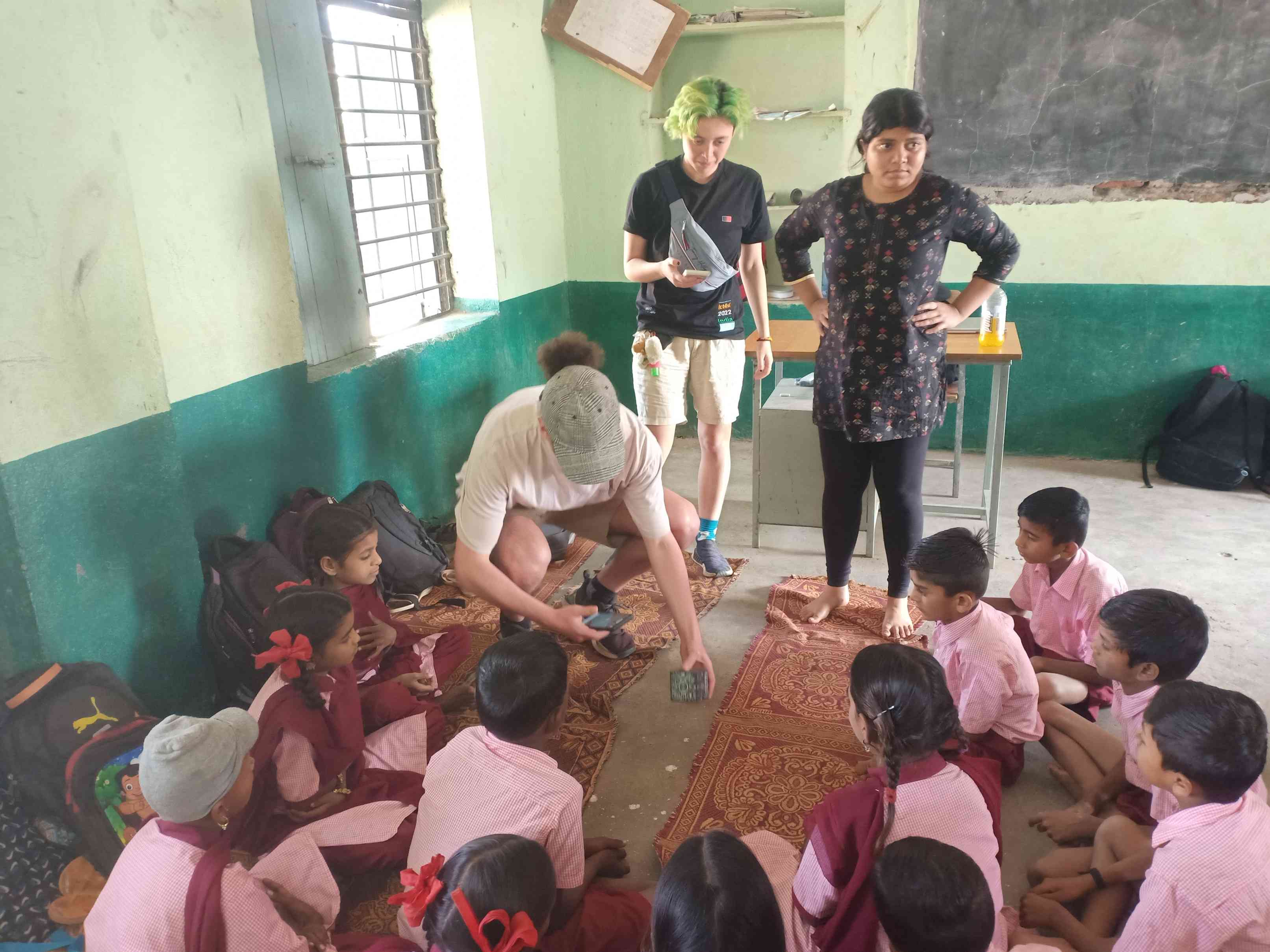 Australian visitors interacting with students
